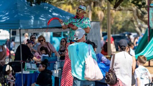 Families gathered along the oceanfront at Myrtle Beach State Park for a colorful day of kite flying during the annual Kite Festival.