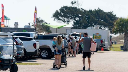 Families gathered along the oceanfront at Myrtle Beach State Park for a colorful day of kite flying during the annual Kite Festival.