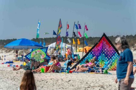 Families gathered along the oceanfront at Myrtle Beach State Park for a colorful day of kite flying during the annual Kite Festival.