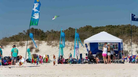 Families gathered along the oceanfront at Myrtle Beach State Park for a colorful day of kite flying during the annual Kite Festival.