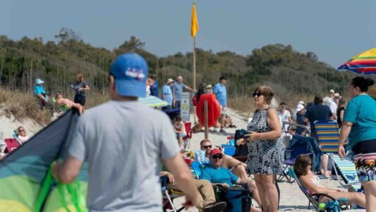 Families gathered along the oceanfront at Myrtle Beach State Park for a colorful day of kite flying during the annual Kite Festival.
