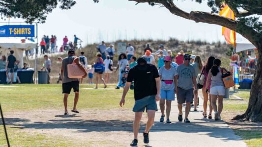 Families gathered along the oceanfront at Myrtle Beach State Park for a colorful day of kite flying during the annual Kite Festival.