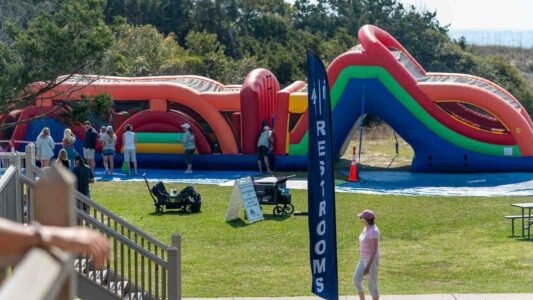 Families gathered along the oceanfront at Myrtle Beach State Park for a colorful day of kite flying during the annual Kite Festival.
